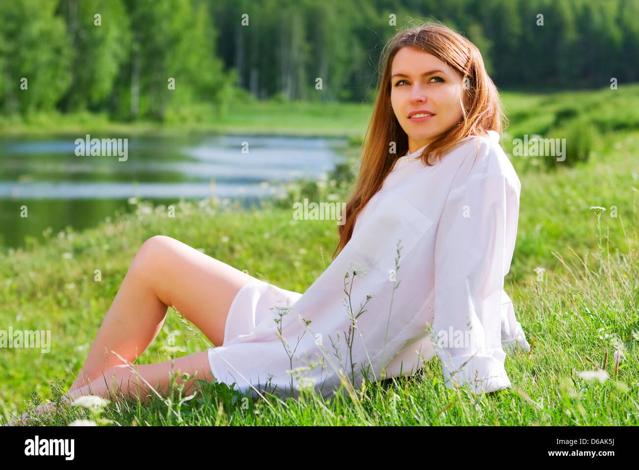 Young woman relaxing on nature Stock Photo - Alamy