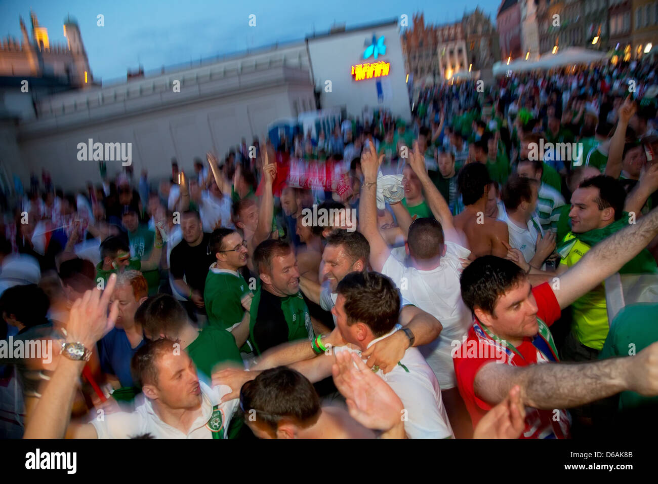 Poznan, Poland, Irish football fans dancing at Stary Rynek Stock Photo
