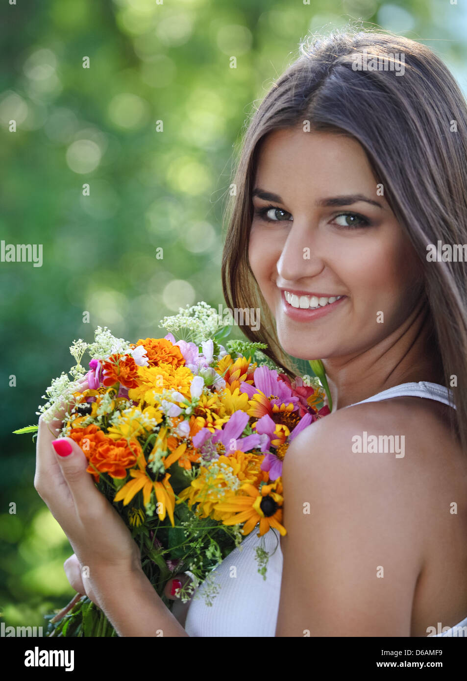 Beautiful young girl in summer park Stock Photo - Alamy