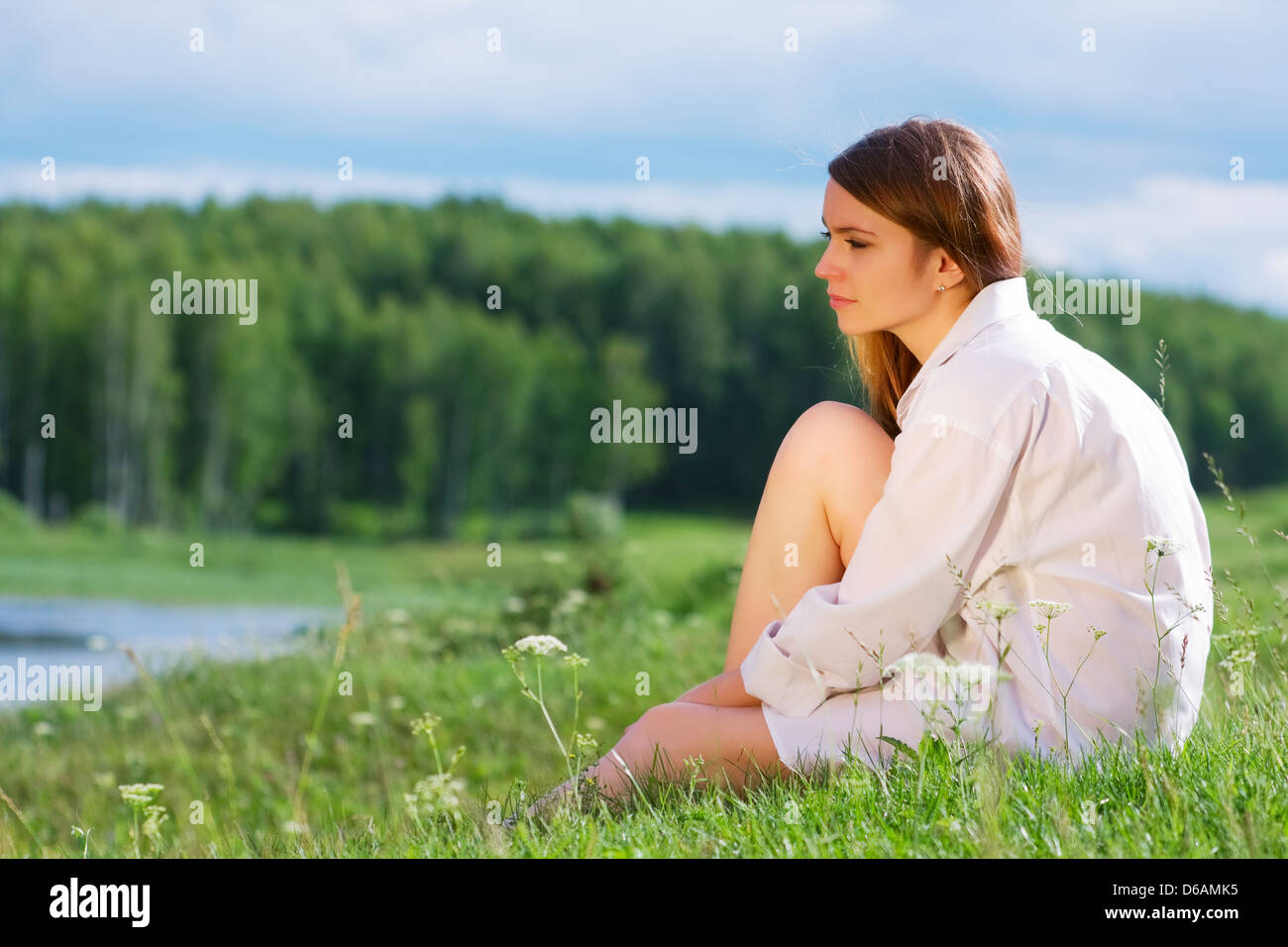 Young woman relaxing on nature Stock Photo - Alamy