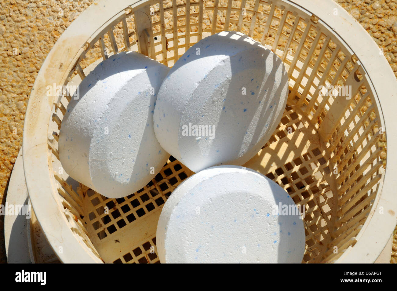 Pool chlorine tablets in basket, Costa del Sol, Andalucia, Spain, Western Europe. Stock Photo
