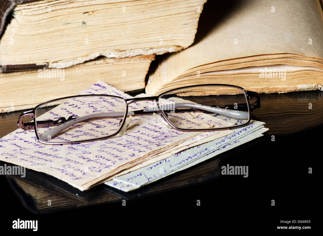 Pile of old books on black Stock Photo Alamy