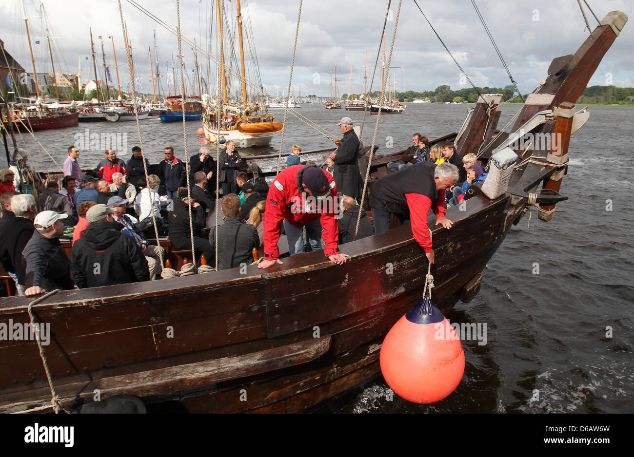 At the city harbor, the first ships go for a trip at the 22nd Hanse Sail festival in Rostock, Germany, 09 August 2012. The maritime festival runs from 09 until 12 August 2012 and features 170 traditional and museum ships. Photo: BERND WUESTNECK Stock Photo