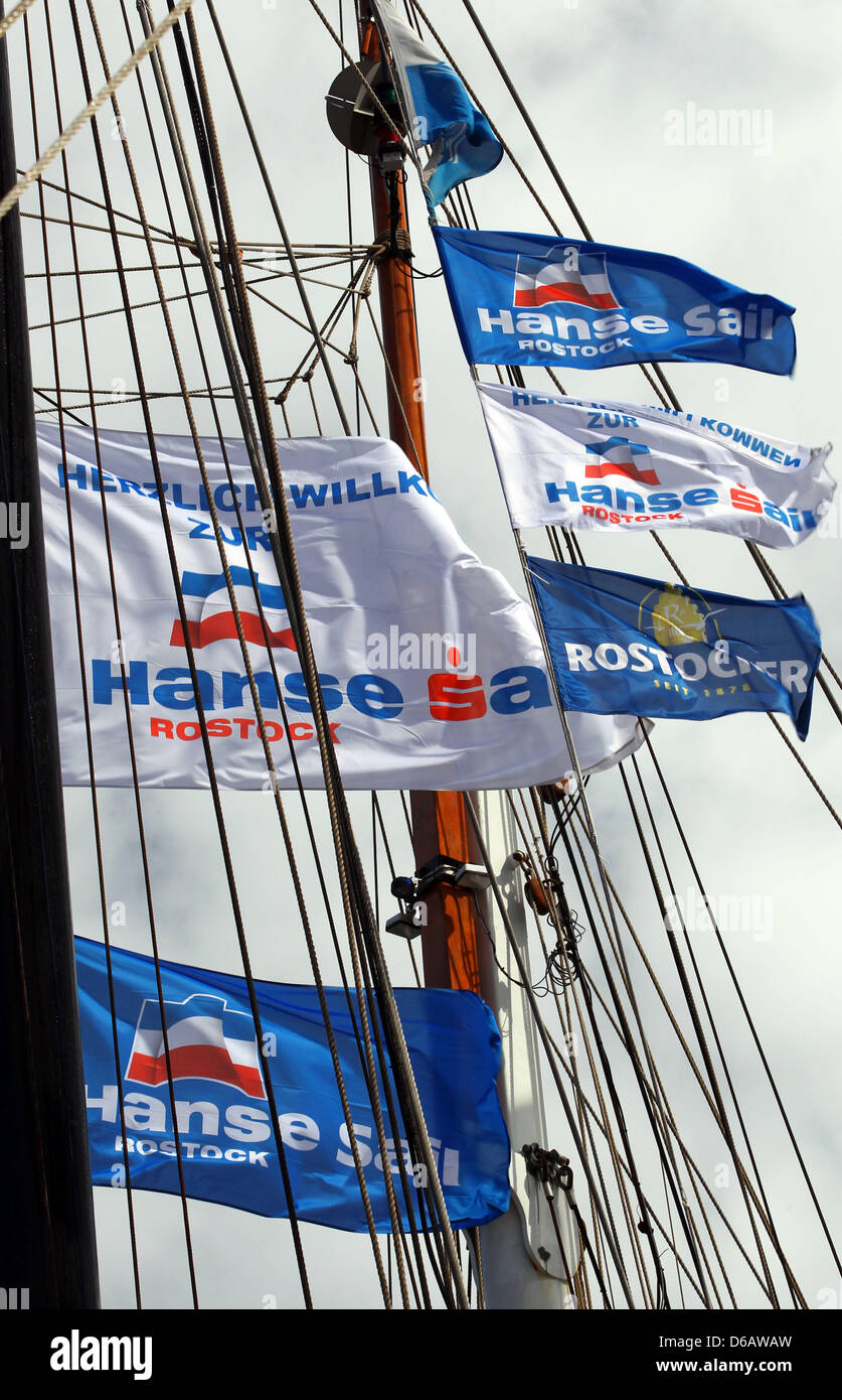 Hanse Sail flags wave at masts of sailing vessels taking part in the 22nd Hanse Sail festival in the harbour in Rostock, Germany, 09 August 2012. The maritime festival runs from 09 until 12 August 2012 and features 170 traditional and museum ships. Photo: Jens Buettner Stock Photo