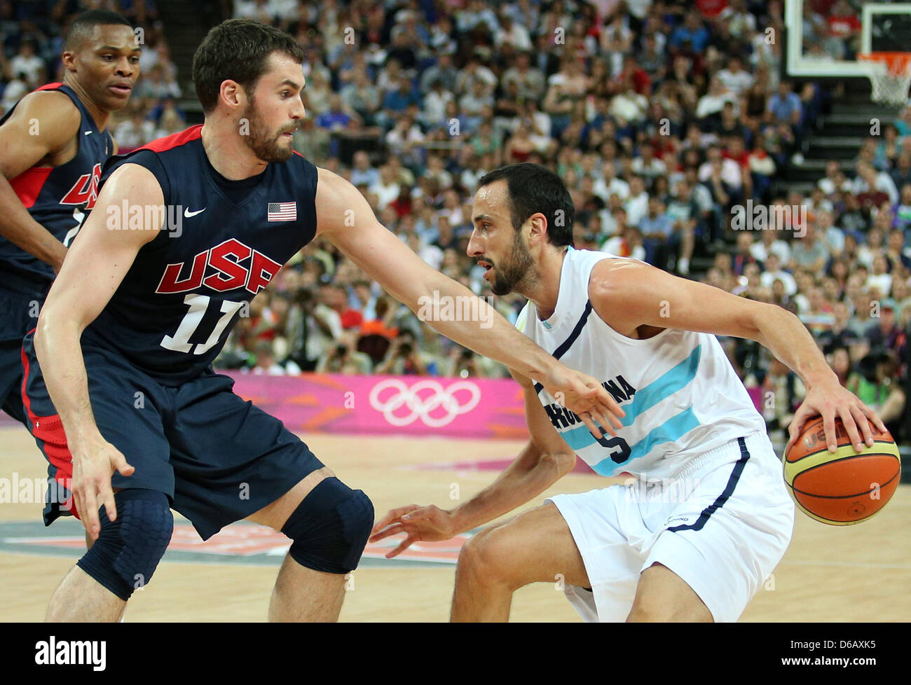 Kevin Love L of the United States in action against Emanuel Ginobili of Argentina during basketball semifinal game in North Greenwich Arena at the London 2012 Olympic Games London Great Britain 10