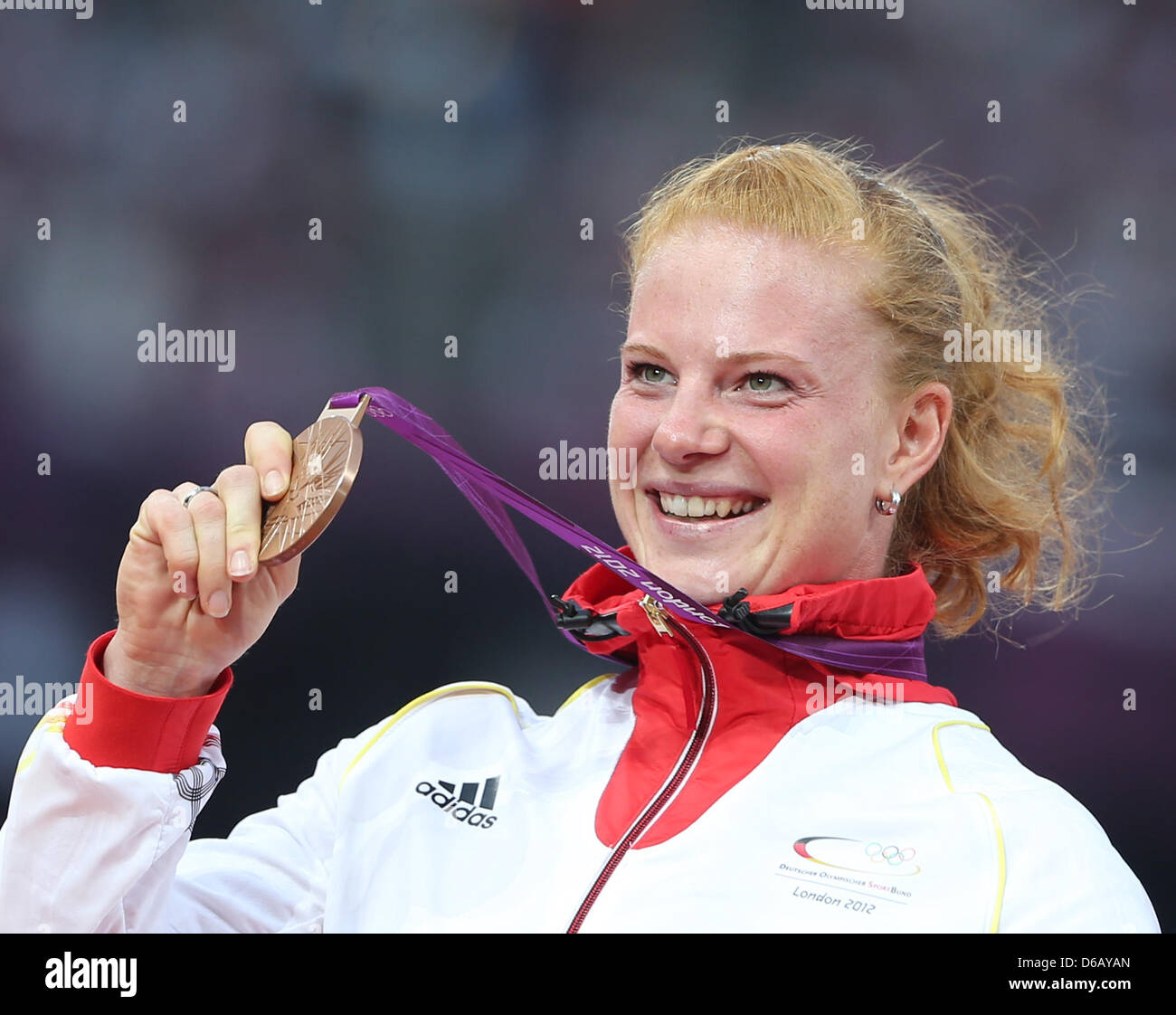 Bronze medalist Betty Heidler of Germany poses with her medal during