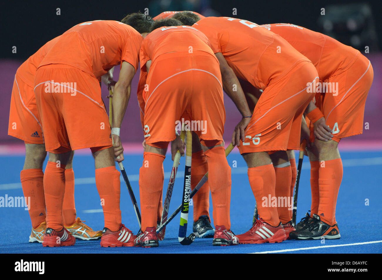 Players of the Netherlands stands together prior to the Hockey Gold Medal Match between Germany