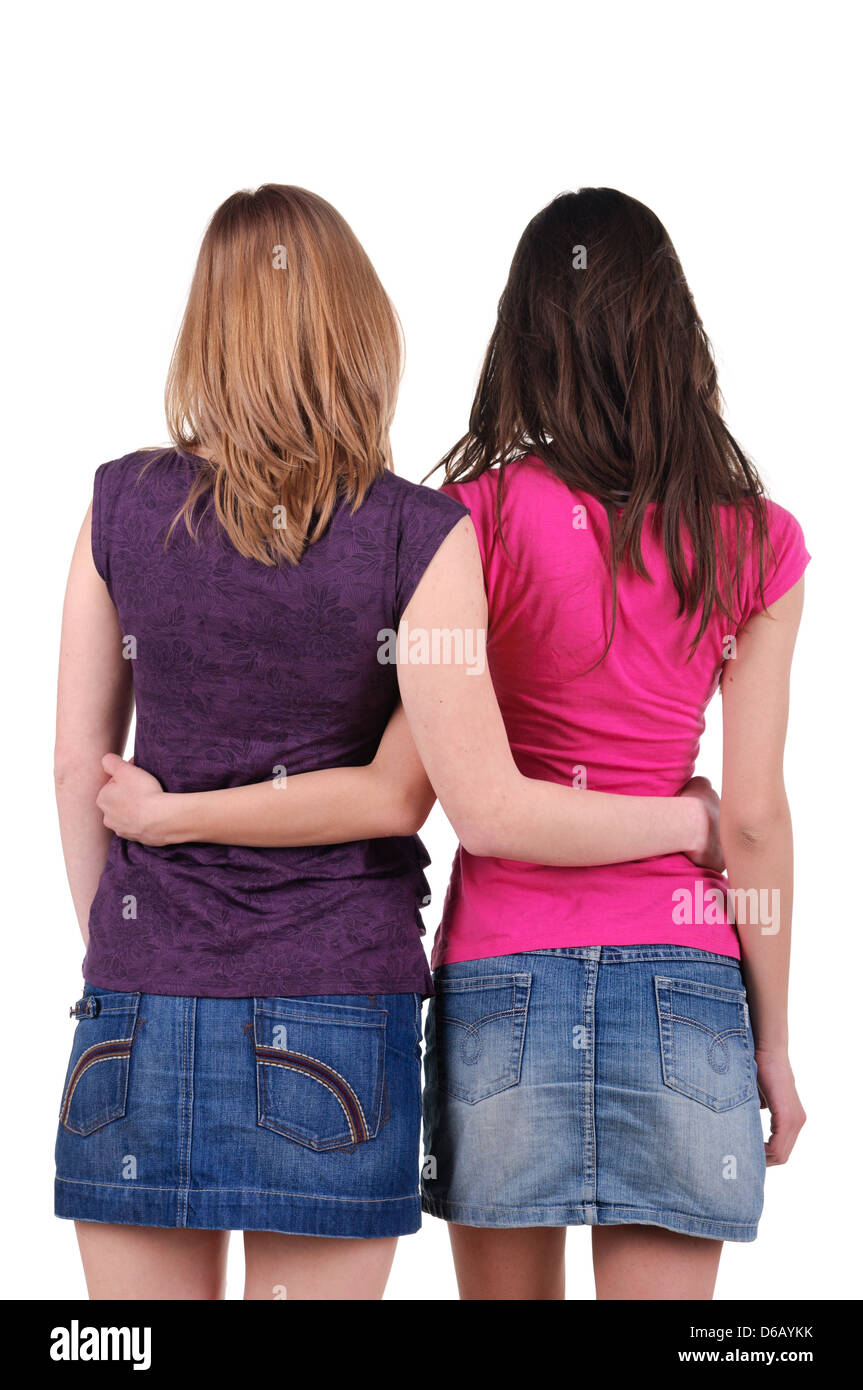Two beautiful young women. Rear view. Isolated over white Stock Photo ...