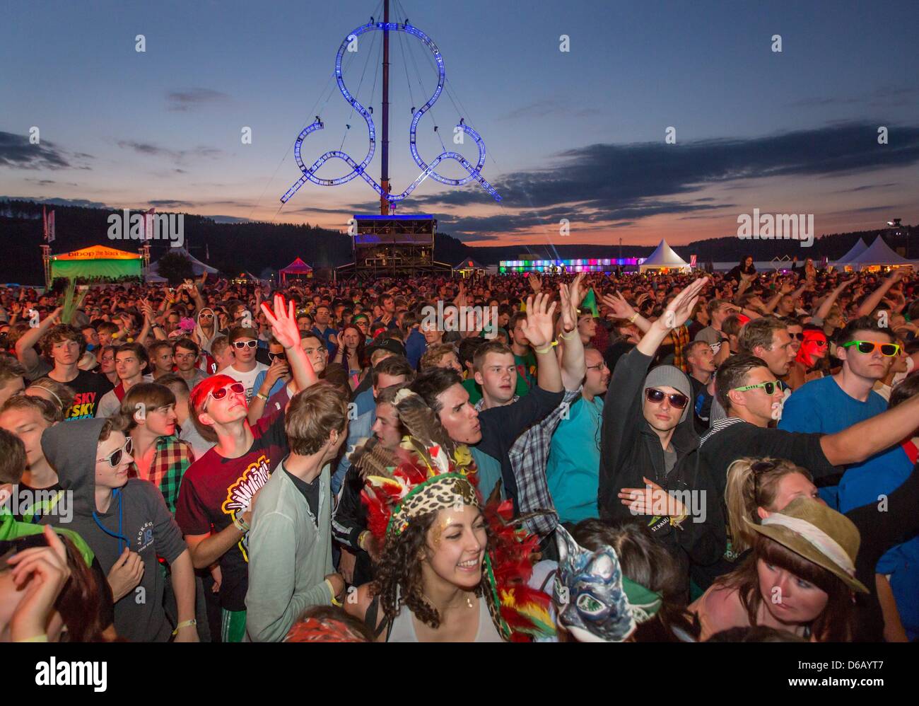 People dance at the electronic music festival 'SonneMondSterne