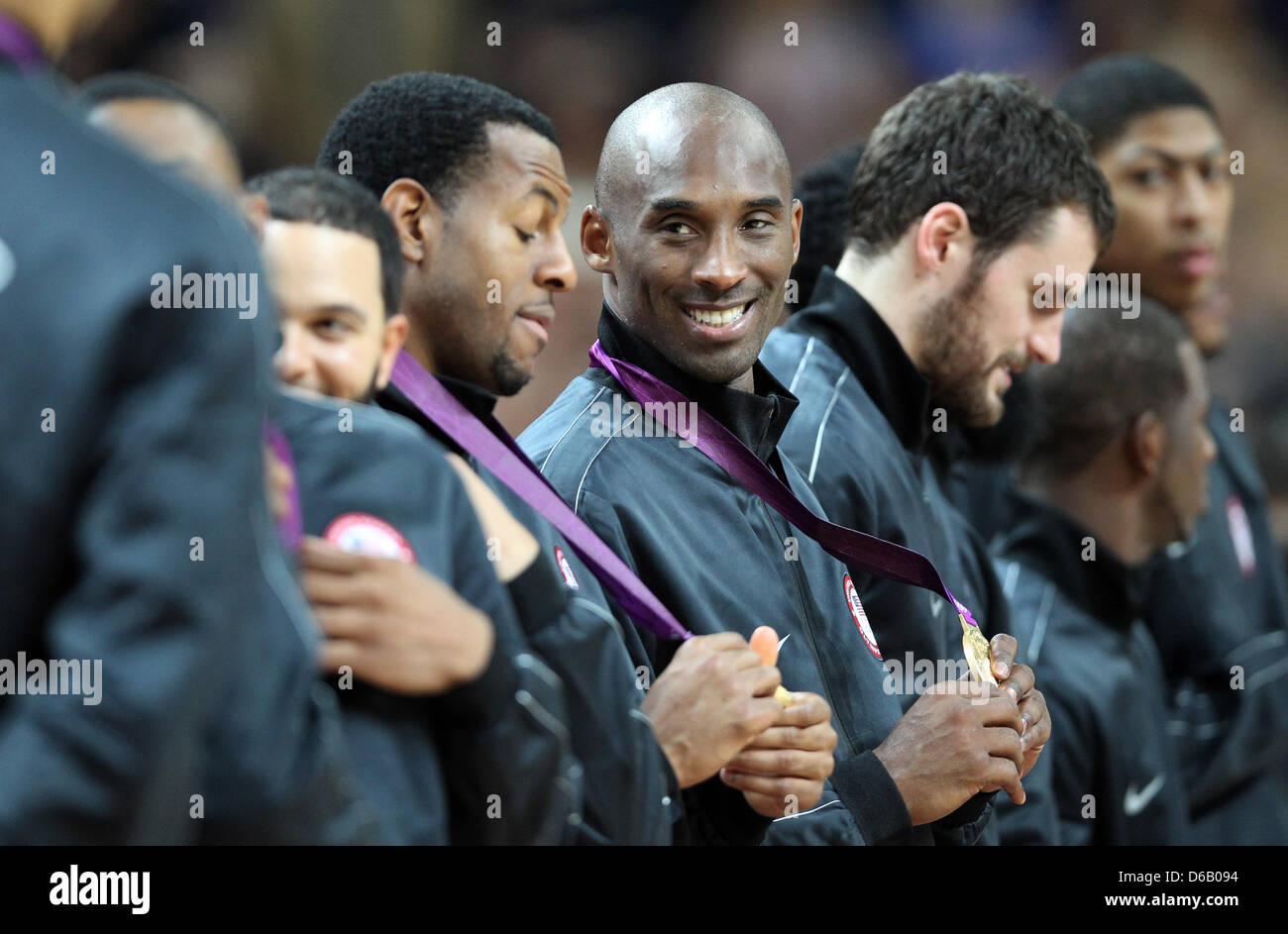 Andre Iguodala (L-R), Kobe Bryant and Kevin Love of the United States celebrate their gold medals during the medal ceremony after winning the basketball final game against Spain in North Greenwich Arena at the London 2012 Olympic Games, London, Great Britain, 12 August 2012. Photo: Friso Gentsch dpa  +++(c) dpa - Bildfunk+++ Stock Photo