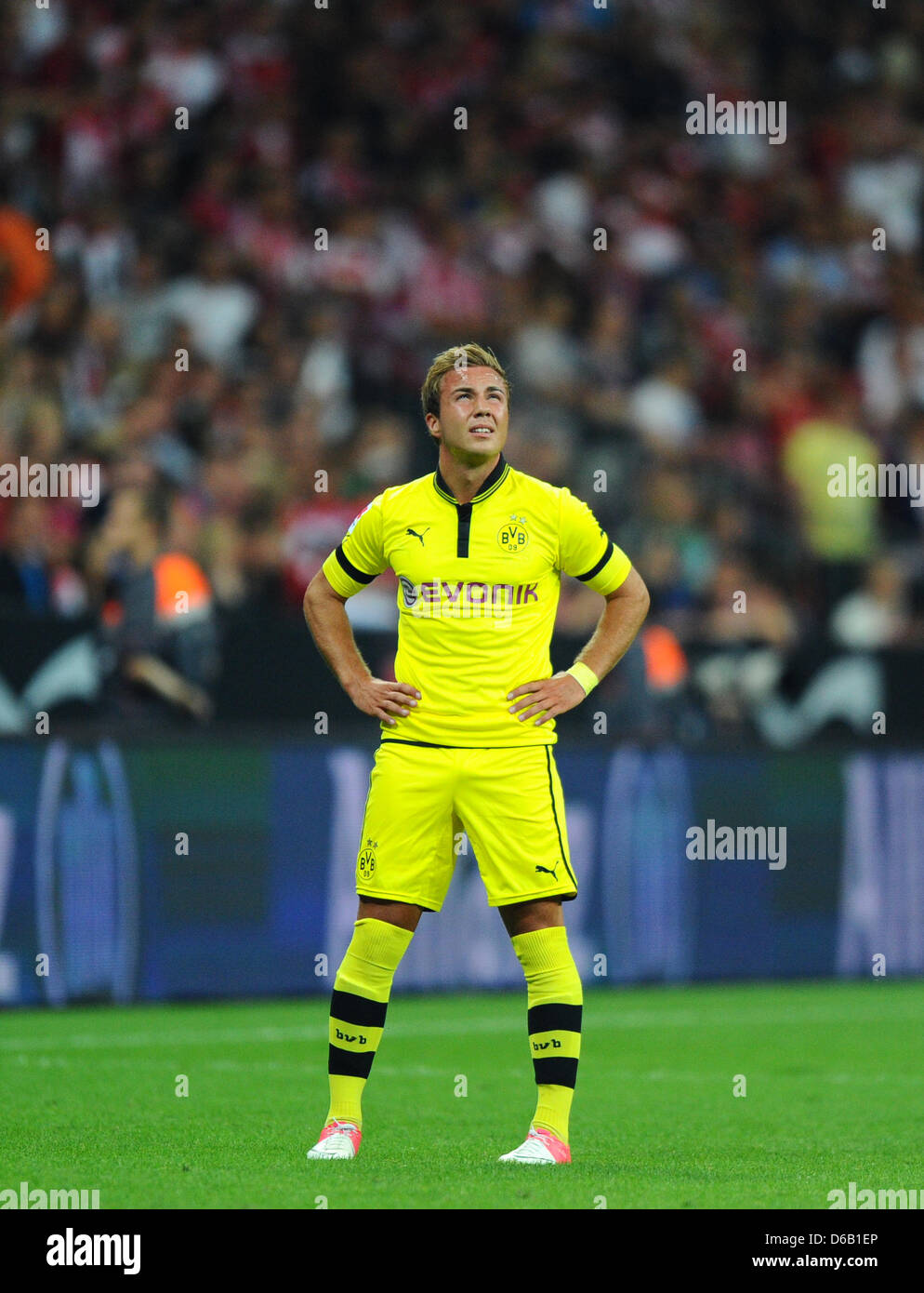 Dortmund's Mario Goetze stands on the pitch during the DFL Super Cup final match between FC Bayern Munich and Borussia Dortmund at the Allianz Arena in Munich, Germany, 12 August 2012. Photo: Thomas Eisenhuth Stock Photo