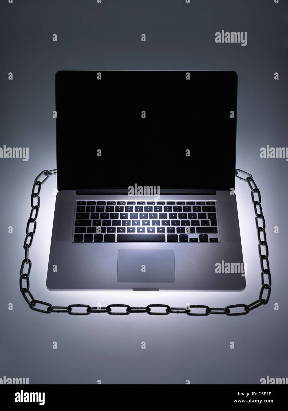 Chain around laptop computer Stock Photo