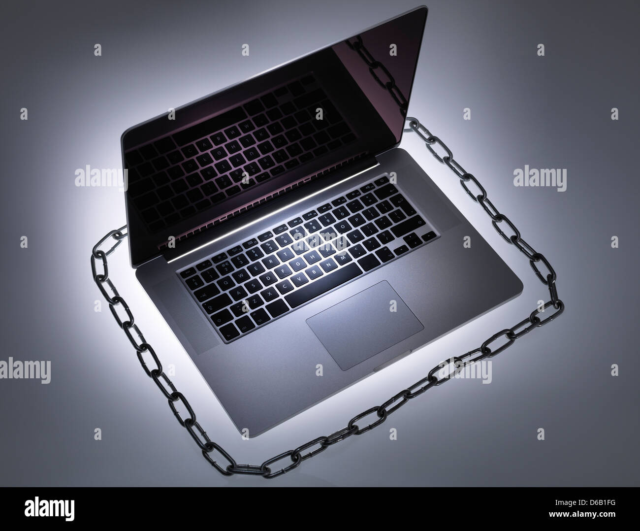 Chain around laptop computer Stock Photo