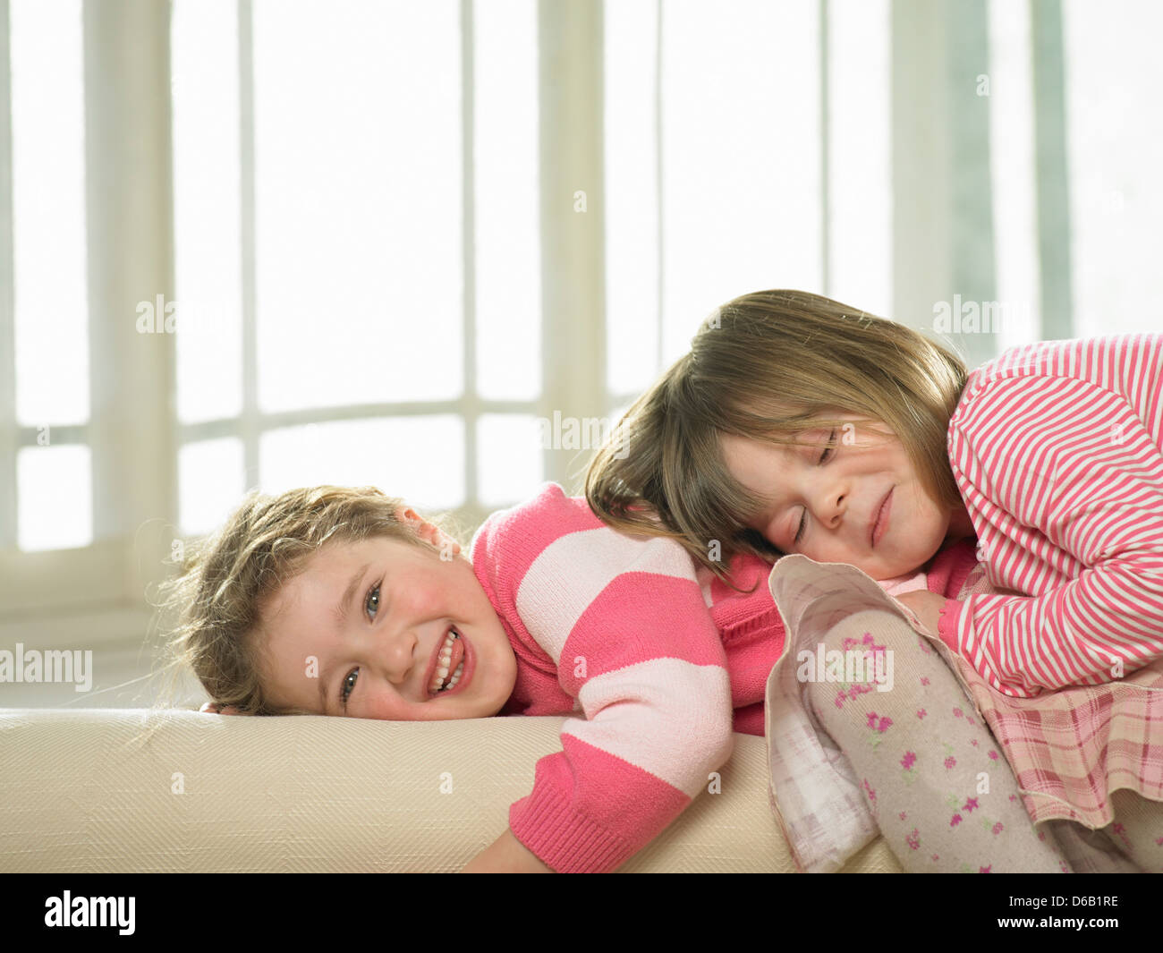 Girls playing together indoors Stock Photo