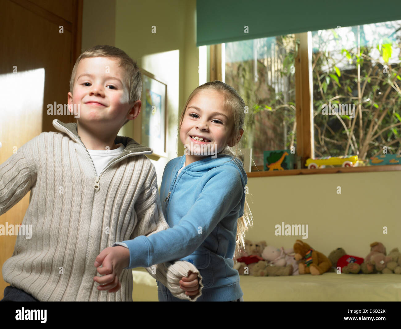 Children playing together indoors Stock Photo