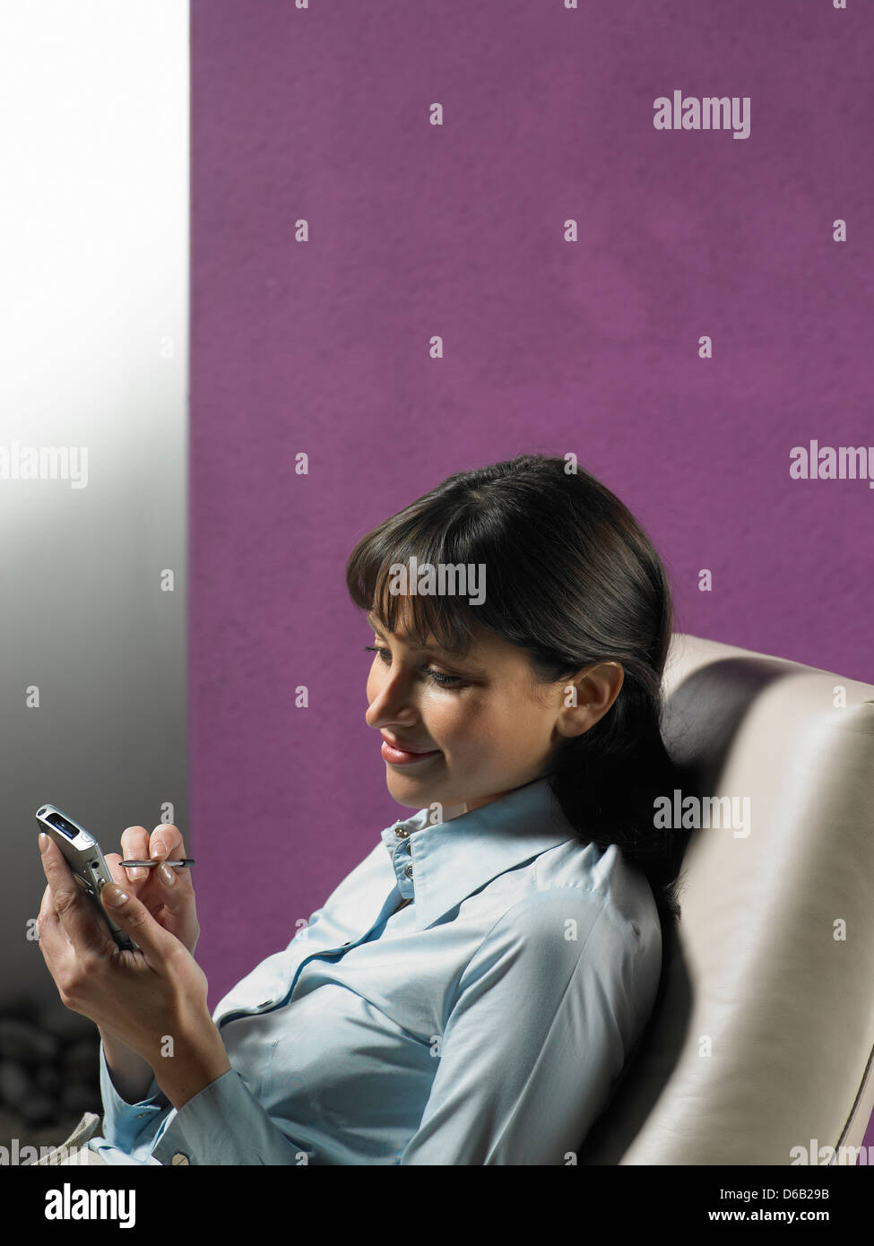 Businesswoman using cell phone Stock Photo