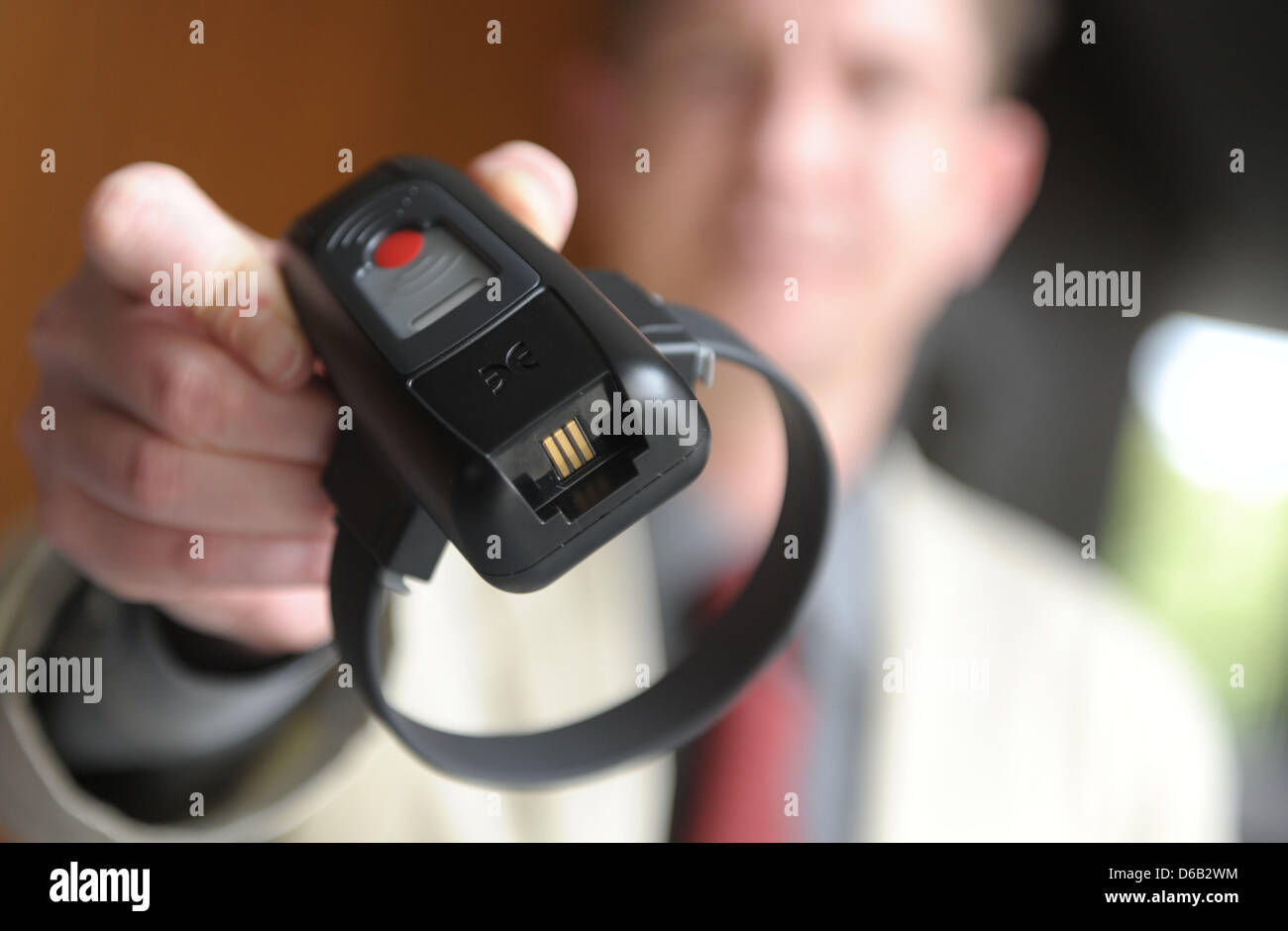 (FILE) An archive photo dated 16 August 2011 shows an electronic tag being held at the state parliament in Hanover, Germany. Photo: Peter Steffen Stock Photo