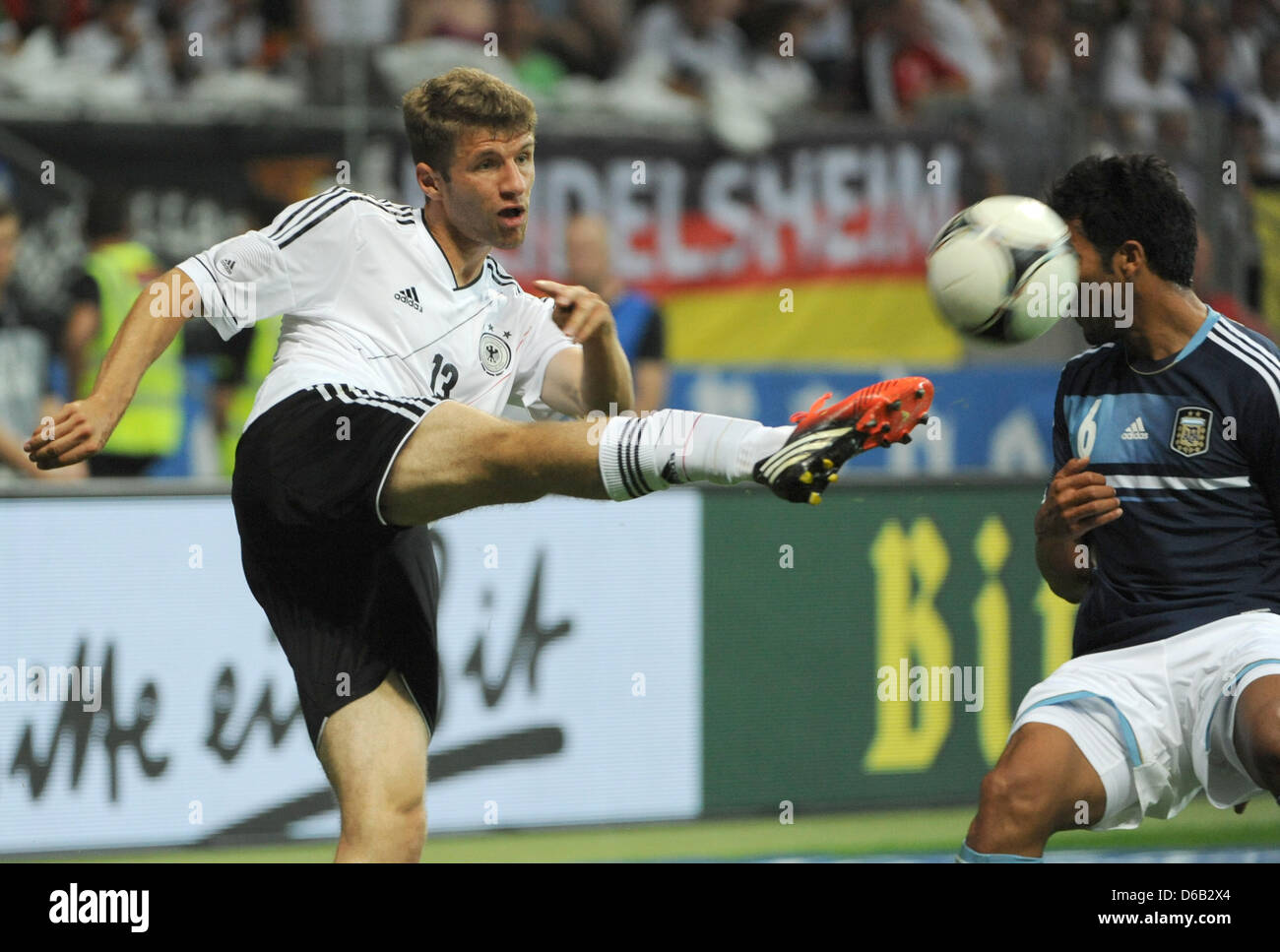 Germany's Thomas Mueller (l) vies for the ball with Argentina's Ezequiel Garay during their friendly soccer match at the Commerzbank-Arena in Frankfurt/ Main, Germany , 15 August 2012. Photo: Arne Dedert dpa/lhe  +++(c) dpa - Bildfunk+++ Stock Photo