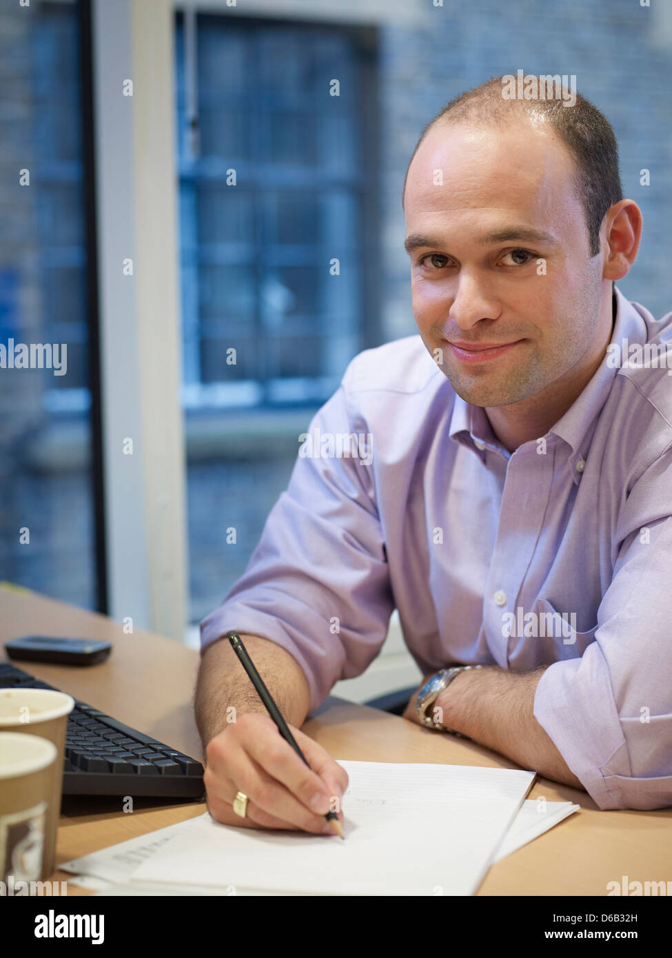 Businessman working at desk Stock Photo