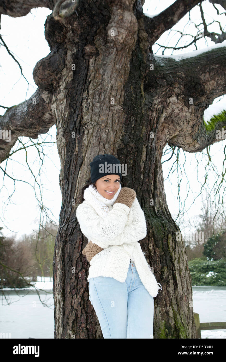 Woman standing in snowy field Stock Photo - Alamy