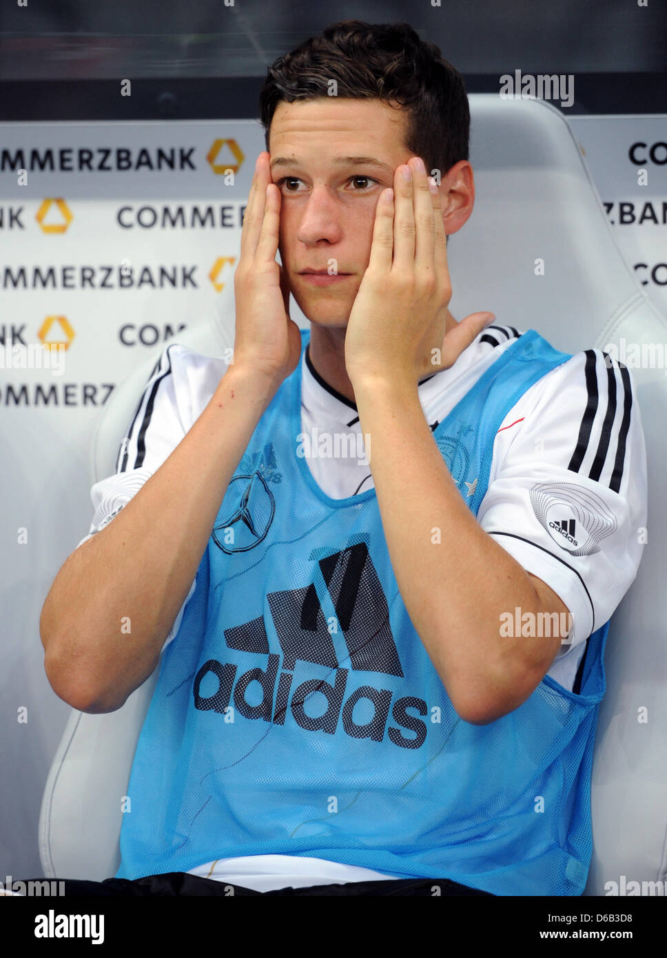 Germany's Julian Draxler sits on the bench during the friendly soccer match between Germany and Argentina at the Commerzbank-Arena in Frankfurt/Main, Germany, 15 August 2012. Photo: Arne Dedert Stock Photo