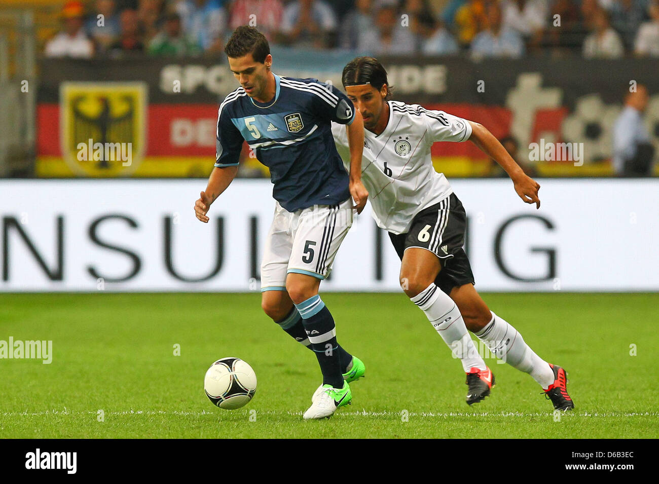 Germany's Sami Khedira (R) vies for the ball with Argentina's Fernando Gago  during the friendly soccer match between Germany and Argentina at the Commerzbank-Arena in Frankfurt/Main, Germany, 15 August 2012. Photo: Revierfoto Stock Photo