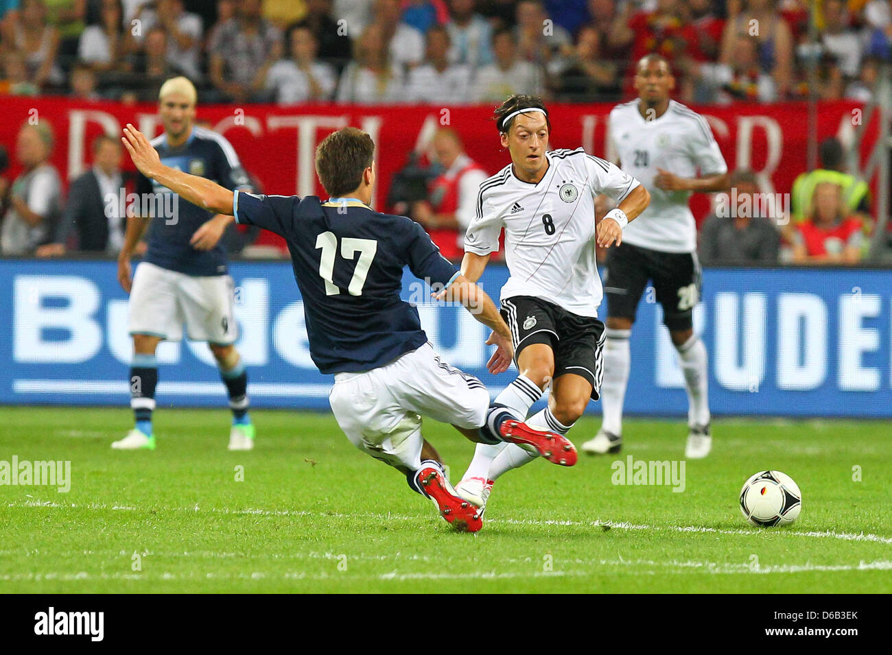 Germany's Mesut Ozil (R) vies for the ball with Argentina's Federico Fernandez during the friendly soccer match between Germany and Argentina at the Commerzbank-Arena in Frankfurt/Main, Germany, 15 August 2012. Photo: Revierfoto Stock Photo