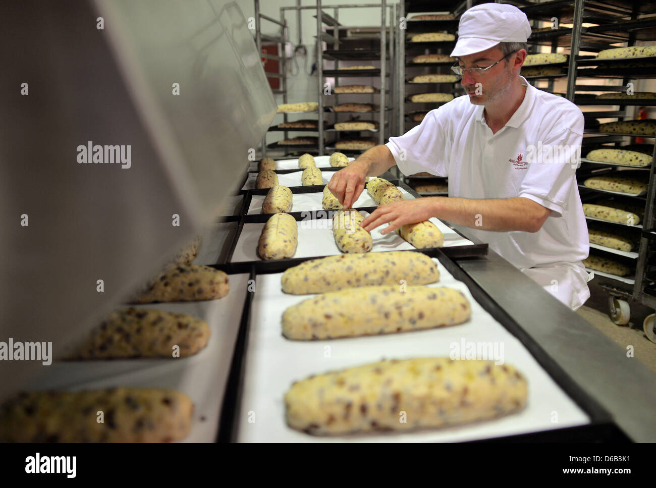 The first stollen of the year is is prepared by baker Michael Kreher at Annaberger Backwaren company in Annaberg-Buchholz, Germany, 16 August 2012. Stollen from the Arch Mountains is sold to more than 50 countries worldwide, among them the USA, Canada and Australia. Photo: HENDRIK SCHMIDT Stock Photo