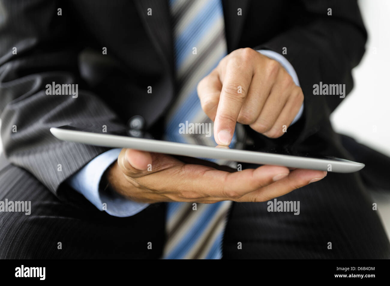 Businessman using tablet computer Stock Photo