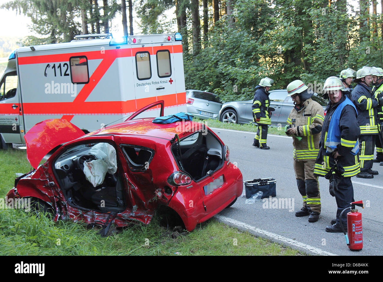 A car is completely destroyed after an accident on a street near