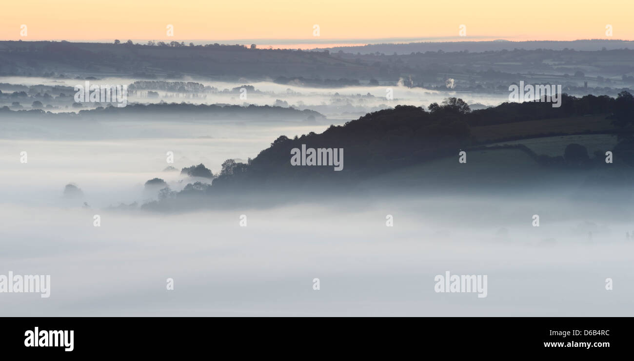 Mist filled valleys near Glastonbury on the Somerset Levels, UK. Stock Photo
