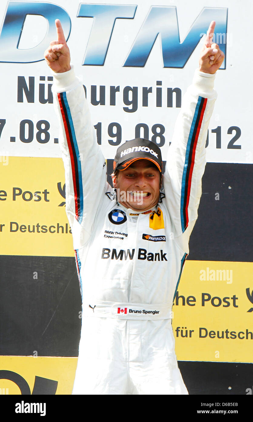 Canadian racing driver Bruno Spengler of BMW celebrates his victory of the 6th race of the German Touring Car Masters (DTM) at the Nuerburgring, Gerrmany, 19 August 2012. Photo: JUERGEN TAP Stock Photo