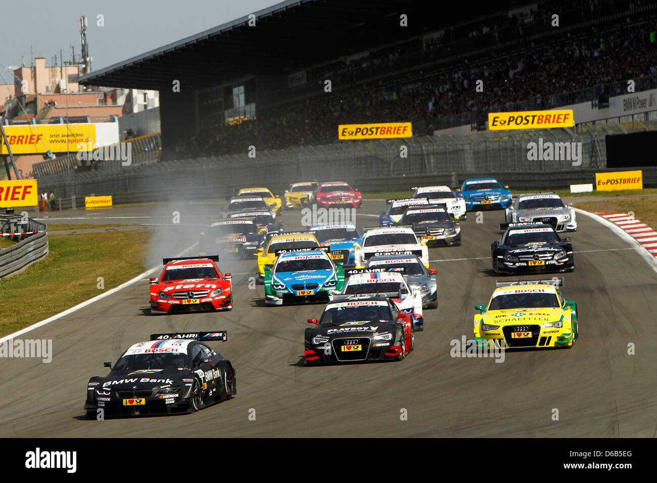 Canadian racing driver Bruno Spengler (L) of BMW leads after the start of the 6th race of the German Touring Car Masters (DTM) at the Nuerburgring, Gerrmany, 19 August 2012. Photo: JUERGEN TAP Stock Photo