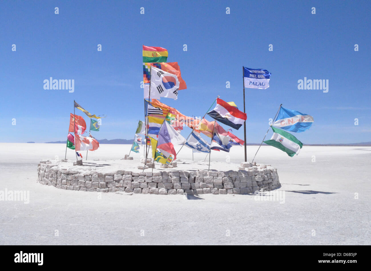 Flags of the world flying outside the Salt hotel near Uyuni, Bolivia Stock Photo
