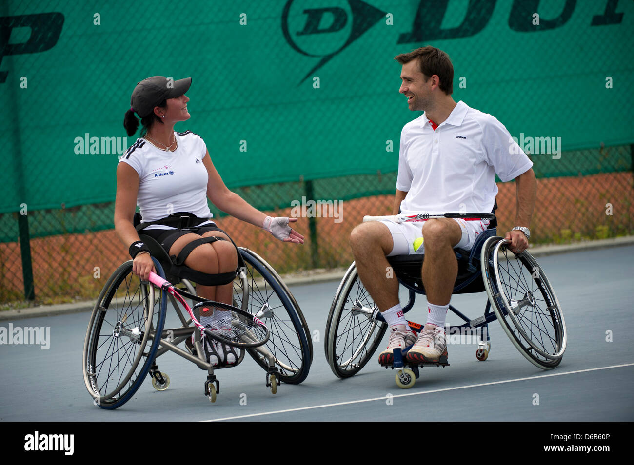 Wheelchair tennis pro Petra-Katharina Krueger jokes with fomer tennis pro Nicolas Kiefer at TennisBase in Hanover, Germany, 20 August 2012. 22-year-old Ms Krueger will compete in this year's Paralympics, which take place from 29 August to 9 September in London, Great Britain. Photo: EMILY WABITSCH Stock Photo