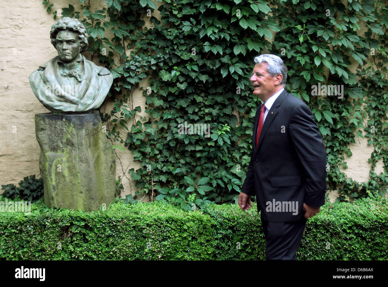 German President Joachim Gauck walks past a Beethoven bust at the Beethoven House in Bonn, Germany, 20 August 2012. Gauck is on his inaugural visit to Bonn. Photo: Oliver Berg Stock Photo