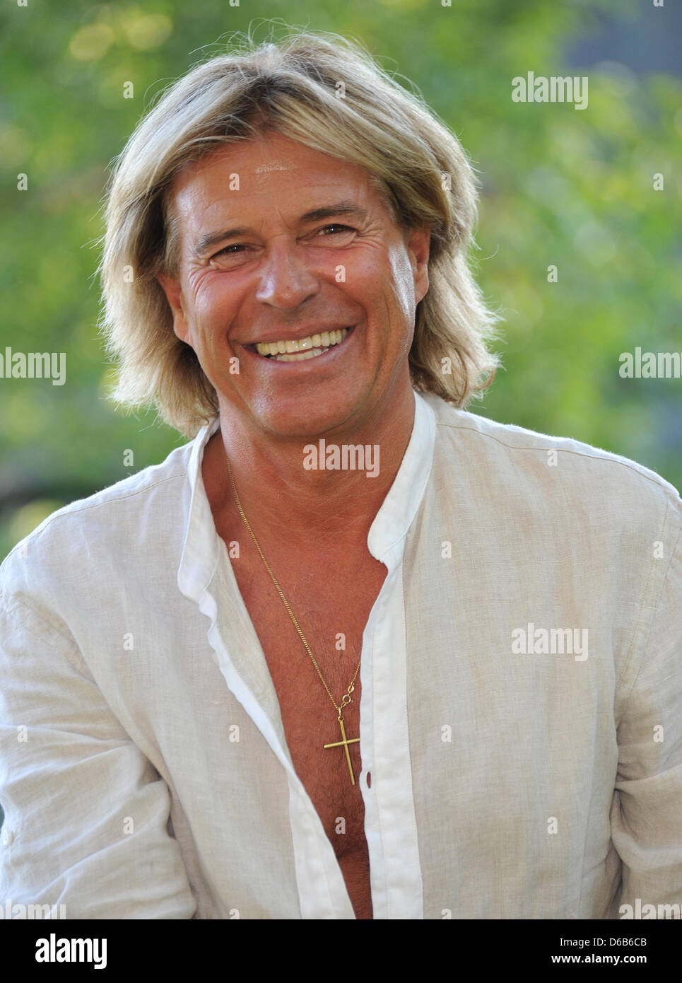 Hansi Hinterseer smiles during the presentation of his new record 'Im siebten Himmel' at the Hauser mountain pasture near Going in Tyrol, Austria, 20 August 2012. Photo: Ursula Dueren Stock Photo