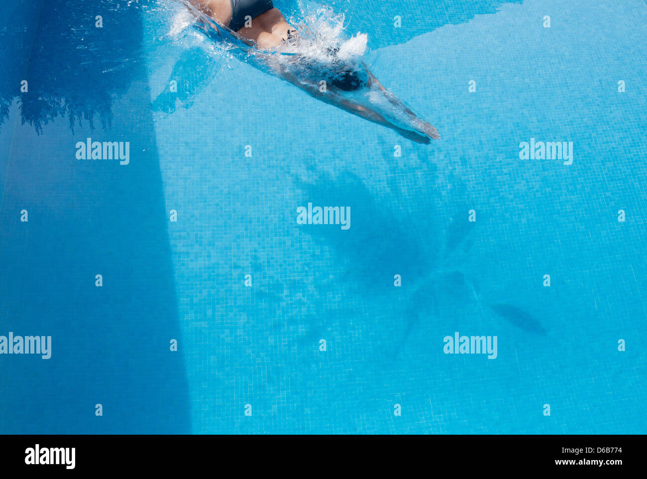 Woman swimming in pool Stock Photo