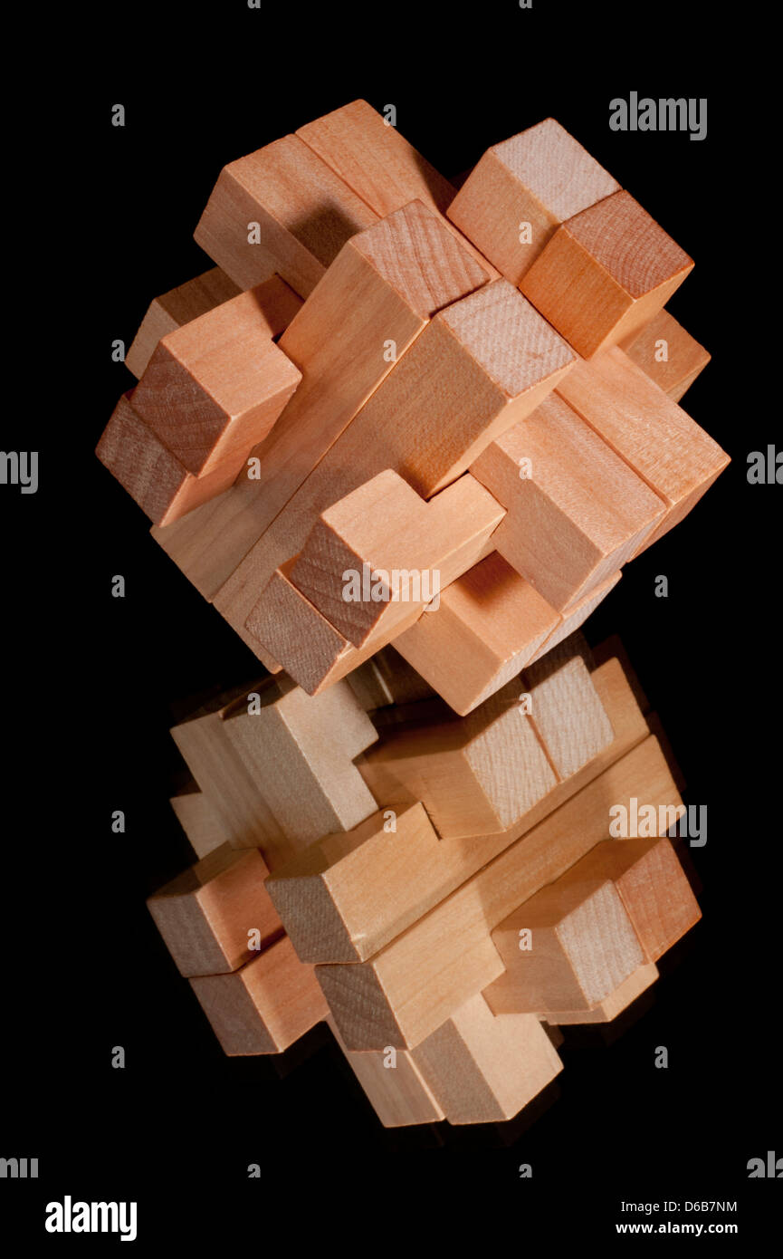 Building blocks with mirror image forming a challenging puzzle isolated on a black background Stock Photo