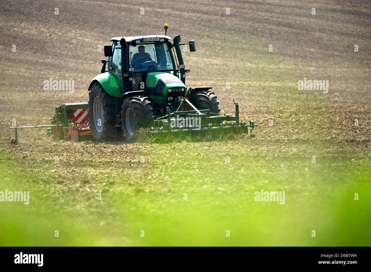 A farmer harrows a field with his tractor near Duderstadt, Germany, 22 ...