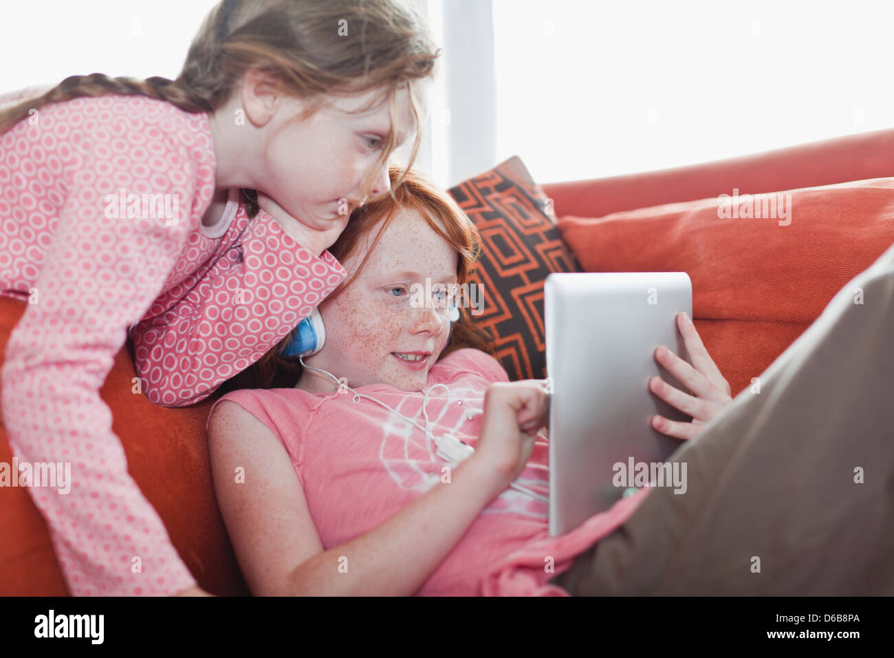 Girls using tablet computer together Stock Photo Alamy
