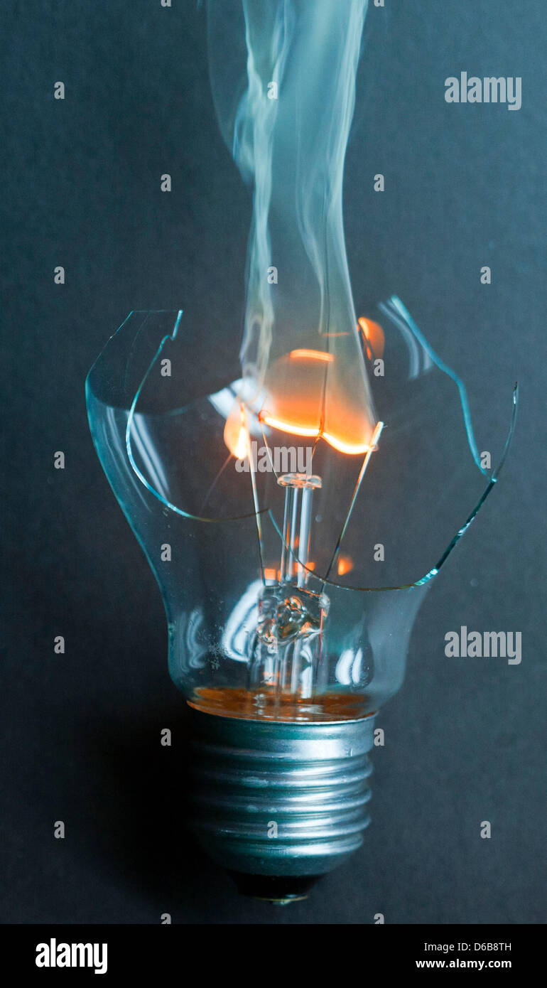 ILLUSTRATION - The filament of a broken 40 W light bulb lights up once