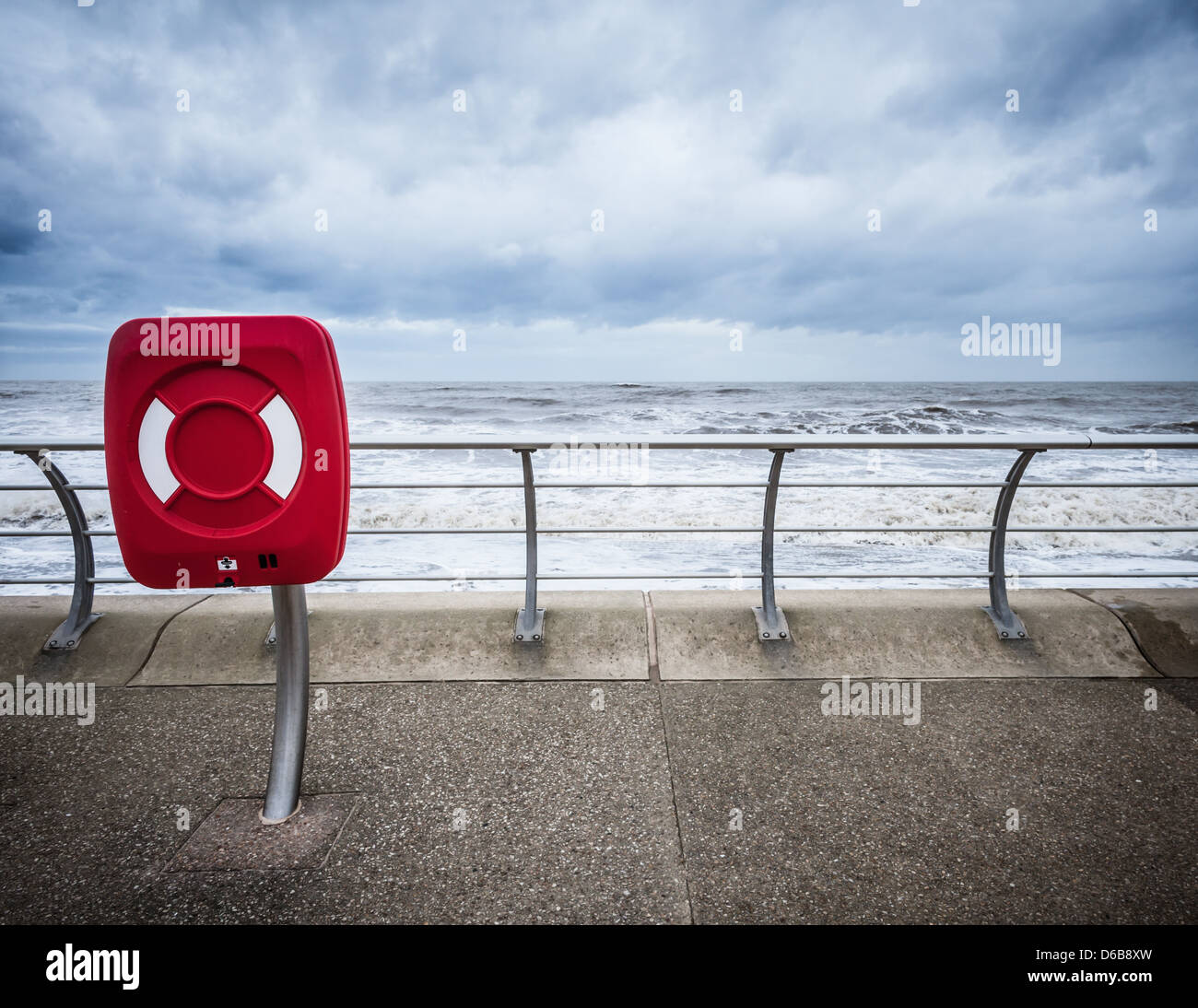 Red sign at beach wall Stock Photo