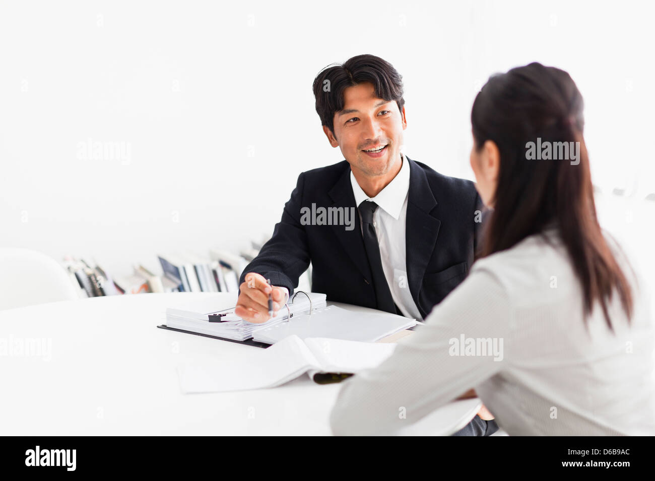 Business people talking at desk Stock Photo