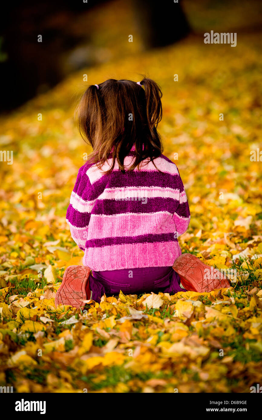 little girl in the autumn park Stock Photo - Alamy