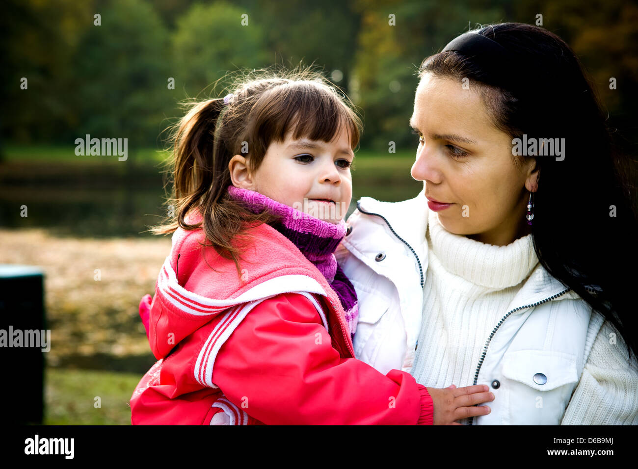 little girl in the autumn park Stock Photo - Alamy