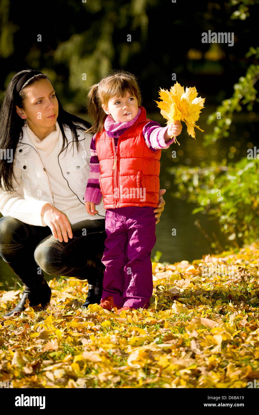 little girl in the autumn park Stock Photo - Alamy