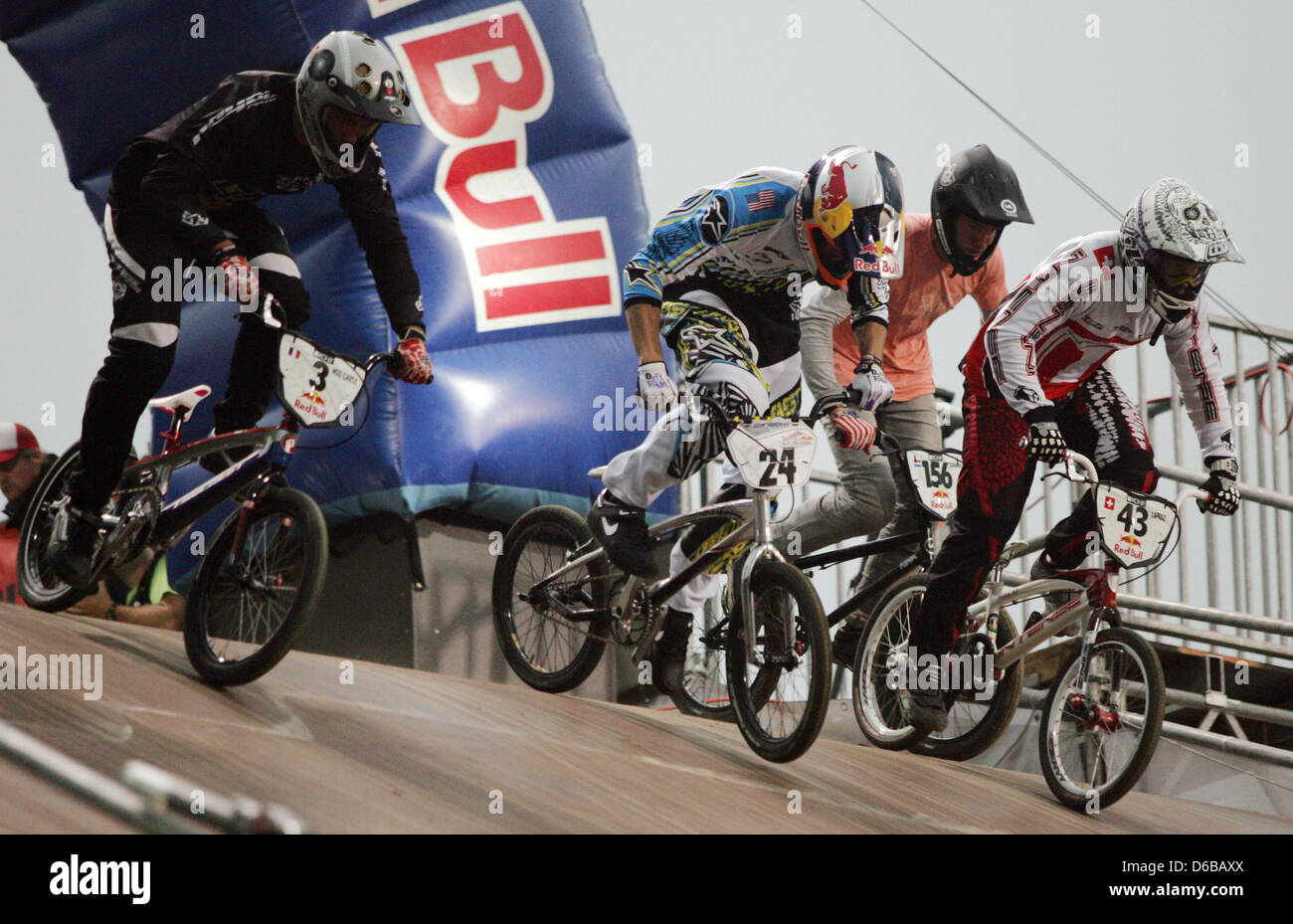 BMX drivers Moana Moo Caille (France, L-R), Corben Sharrah (USA), Yvan  Lapraz (Switzerland) and Desmond Tessemacker (Netherlands) start a race of  the Red Bull R.Evolution at Mellowpark in Berlin, Germany, 24 August