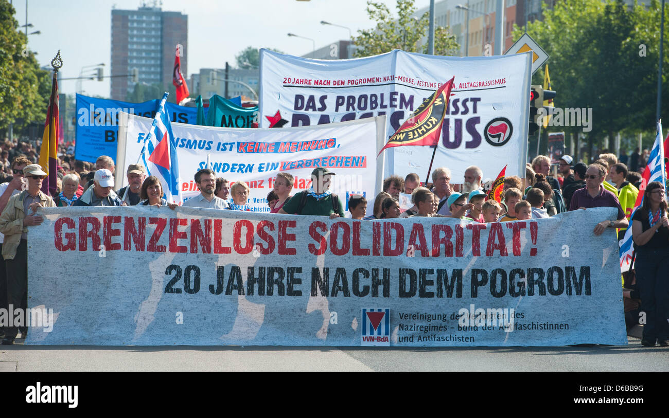 Riots Lettering People hold up a banner with the lettering 'Unlimited solidarity ...