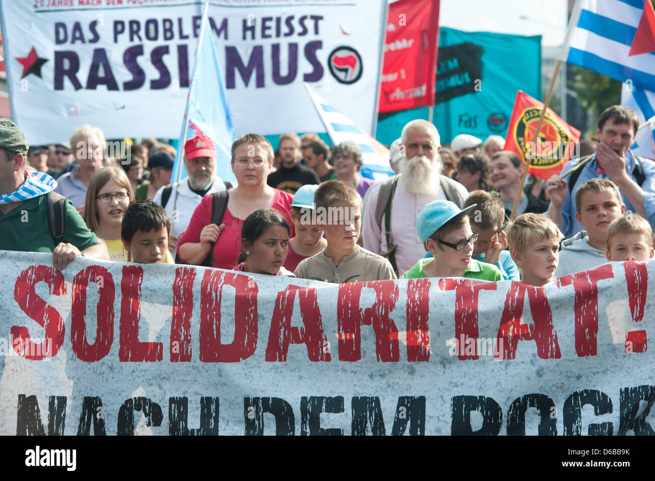 Riots Lettering People hold up a banner with the lettering 'Unlimited solidarity ...